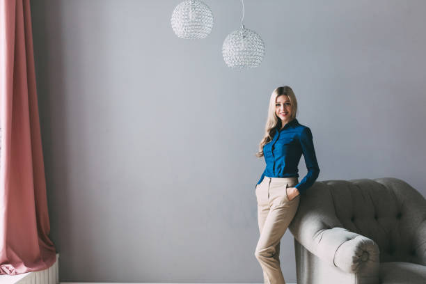 istock Young beautiful woman in a comfortable room. 1067762422