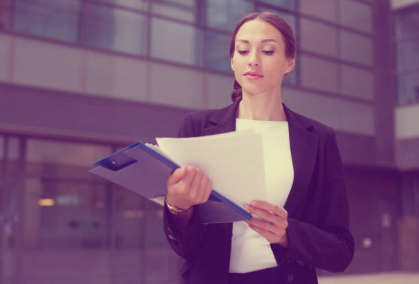 istock Businesswoman is examining documents 1067762620