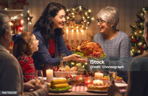 Family Celebrating Christmas Stock Photo - Download Image Now - Christmas, Dinner, Family