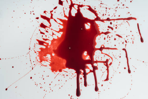 istock top view of flowing blood droplets on white surface 1067765630