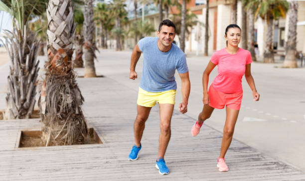 istock Couple running outdoors 1067769796
