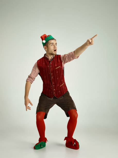 istock friendly man dressed like a funny gnome posing on an isolated gray background 1067772186