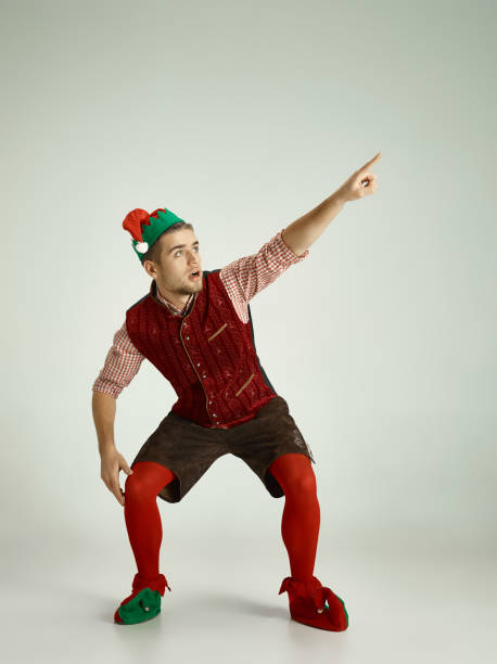 istock friendly man dressed like a funny gnome posing on an isolated gray background 1067772188