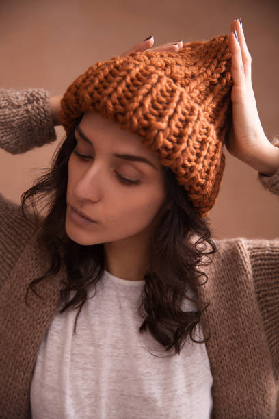 istock Happy woman in knitted hat 1067774592