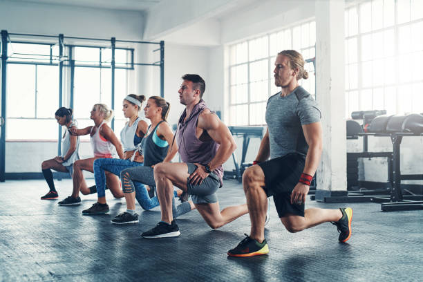 Because a good body doesn't happen by accident Shot of an accountability group working out at the gym circuit training stock pictures, royalty-free photos & images