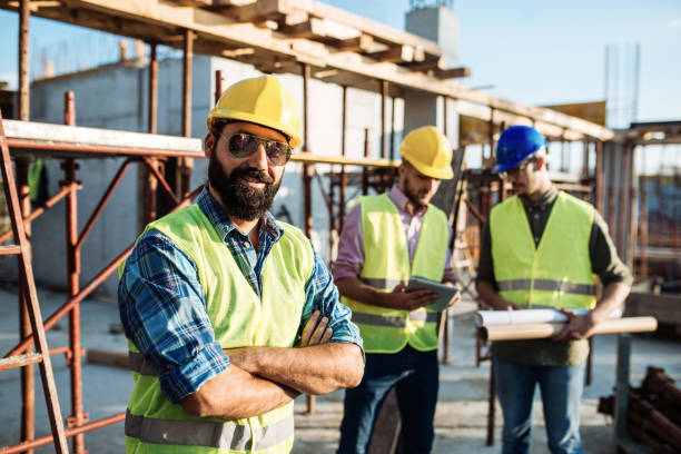 istock Portrait of group of engineers and architects on construction site 1067775748