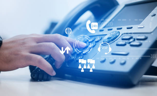 istock close up employee man hand point to press button number on telephone with virtual interface of international communication at office desk , advance future technology concept 1067777418