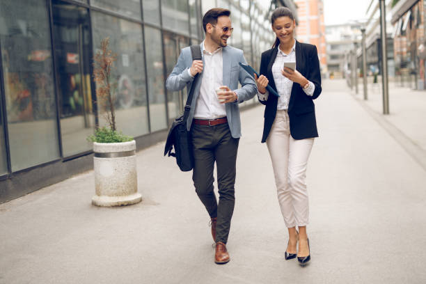 istock Two business people on their way to work 1067782086