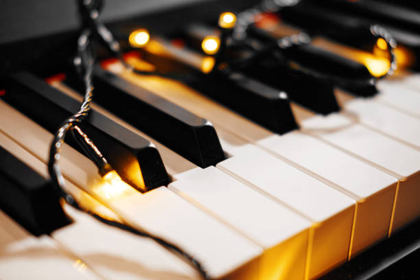 istock piano keys bokeh in the background Christmas lights 1067782490