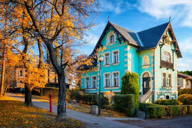 Szczawno Zdroj, Poland - November 06, 2018:Autum view of beautiful old holiday villa with green facade in Szczawno Zdroj , small spa tourist resort in Dolnoslaskie province, Poland