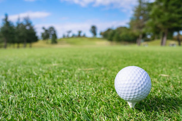 istock Golf Course where the turf is beautiful and Golf Ball on tee. Golf course with a rich green turf beautiful scenery. 1067782794