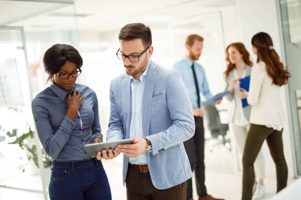 istock Teamwork and technology - Invaluable to modern business 1067784170