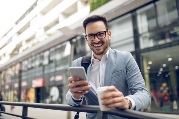 istock Young businessman reading text message on mobile phone 1067784284