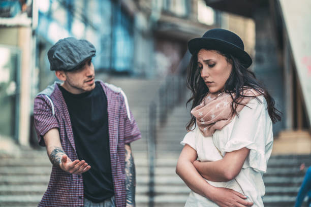 istock Upset young couple arguing on the street 1067787734
