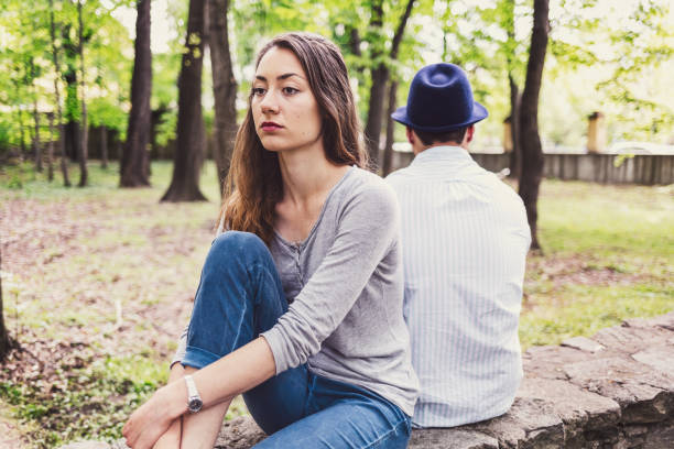 istock Unhappy couple turning backs at each other 1067787762