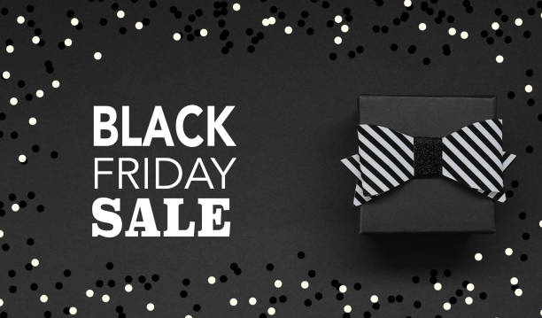 istock Gift Box with bow on black background and Black Friday Text 1067788434