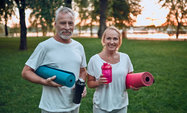 istock Senior couple doing sport outdoors 1067789736