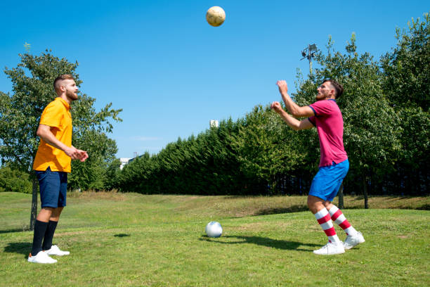 istock Two Male Footgolf Players Warming Up 1067793126