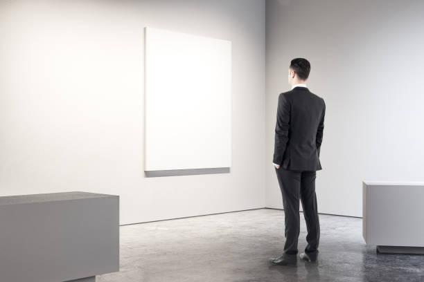 istock Businessman in modern gallery 1067795386