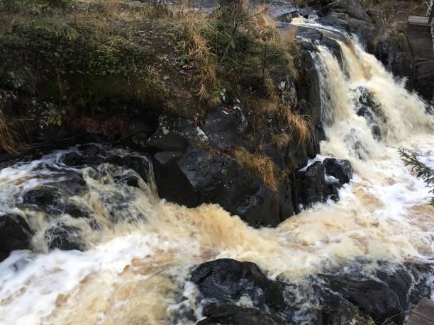 istock Water,Waterfall,Black,Yellow,Stone,White 1067795640