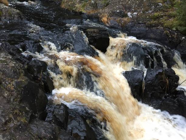 istock Water,Waterfall,Black,Yellow,Stone,White 1067795642