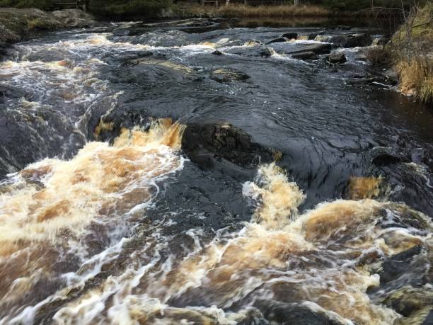 istock Water,Waterfall,Black,Yellow,Stone,White 1067796220