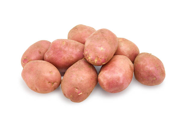 istock fresh potato tubers on white background 1067796994