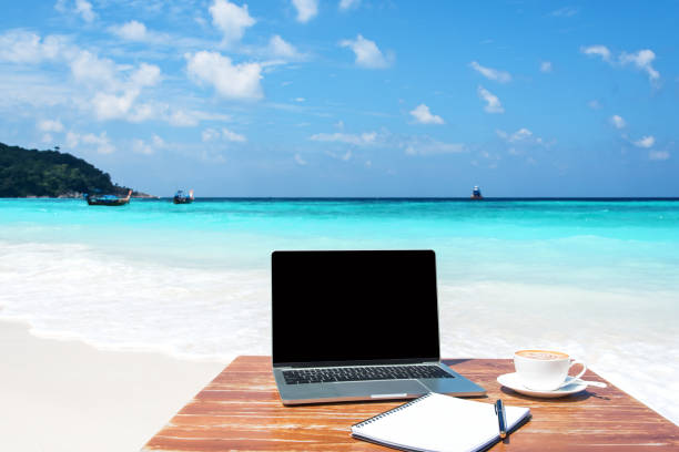 istock Working at The Tropical Beach -- Freelance Work Concept 1067799518