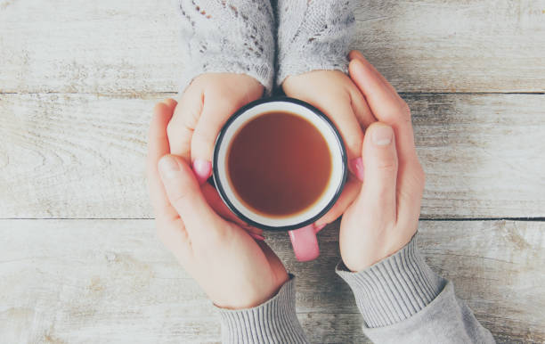 istock A cup of tea in the hands. Selective focus. 1067801036