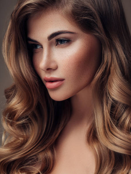 istock Young beautiful model with long wavy well groomed hair 1067802420