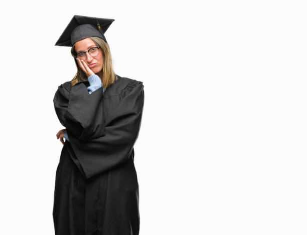 istock Young beautiful woman wearing graduated uniform over isolated background thinking looking tired and bored with depression problems with crossed arms. 1067802606