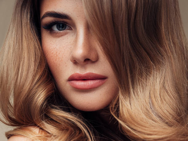 istock Young beautiful model with long wavy well groomed hair 1067802888