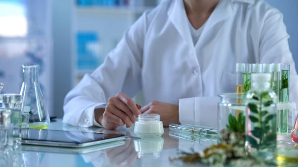 istock Cosmetology lab researcher testing new organic cream, modern tablet on table 1067805834