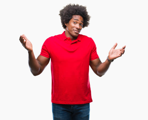 istock Afro american man over isolated background clueless and confused expression with arms and hands raised. Doubt concept. 1067805870