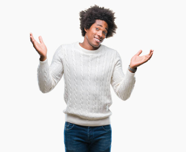 istock Afro american man over isolated background clueless and confused expression with arms and hands raised. Doubt concept. 1067806084