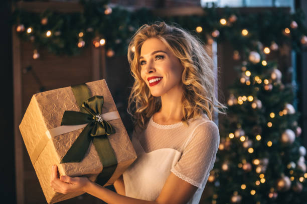 istock Beautiful woman with present 1067808996