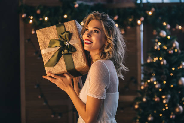 istock Beautiful woman with present 1067809180
