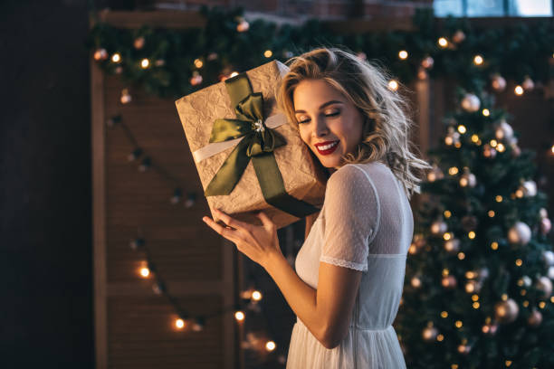 istock Beautiful woman with present 1067809312