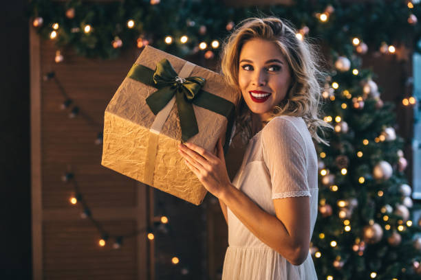 istock Beautiful woman with present 1067809422