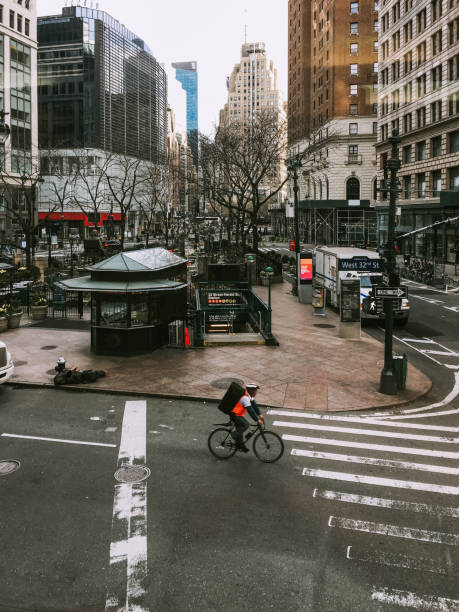 istock bicycle courier at crossing in New York City 1067809768