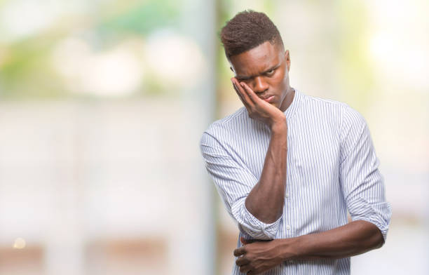 istock Young african american man over isolated background thinking looking tired and bored with depression problems with crossed arms. 1067814280