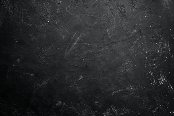 istock Black stone background. Black surface. Top view. Free space for your text. 1067819774