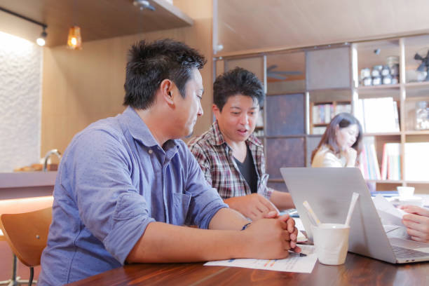 istock business meeting is performed at a design studio. 1067821840