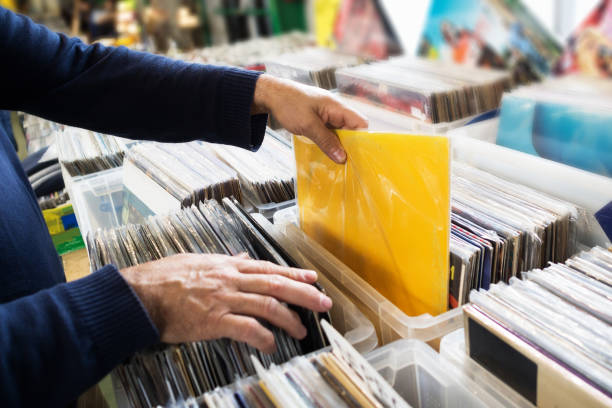 istock Close-up of man's hands, searching a second hand vinyl record. 1067824656