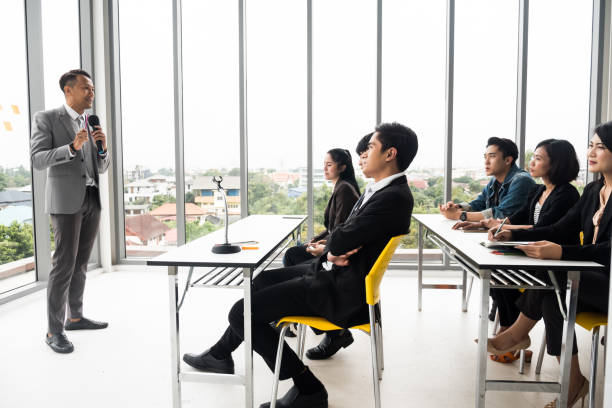 istock Businessman is explaining works to officers while training together at the office. 1067825920