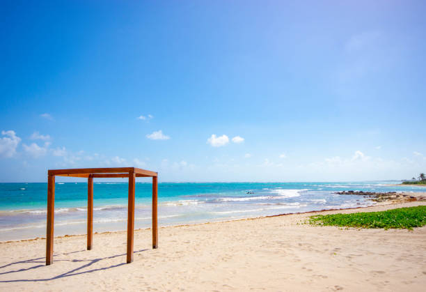 istock Caribbean beach with a wooden structure used for beach weddings 1067826720