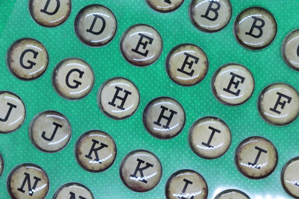 capital letters d, e, g, h, i, j, k of alphabet, in retro circles like typewriter keys, on plain green background - letter j block toy alphabet imagens e fotografias de stock