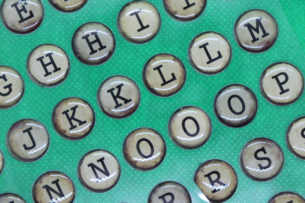 capital letters g, h, j, k. l, m, n, o, p of alphabet, in retro circles like typewriter keys, on plain green background - letter j block toy alphabet imagens e fotografias de stock