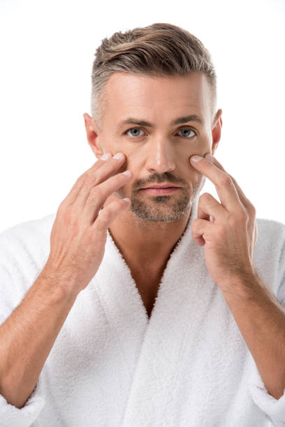 istock man in bathrobe worrying about own appearance isolated on white 1067832166