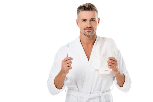 Happy handsome male going through his morning routine stock photo